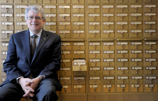 Paul Courant, the Dean of Libraries, at front of the Card Catalog