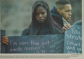 Kinesiology sophomore Capri'Nara Kendall participates in a demonstration organized by the Black Student Union in front of Hill Auditorium Monday.