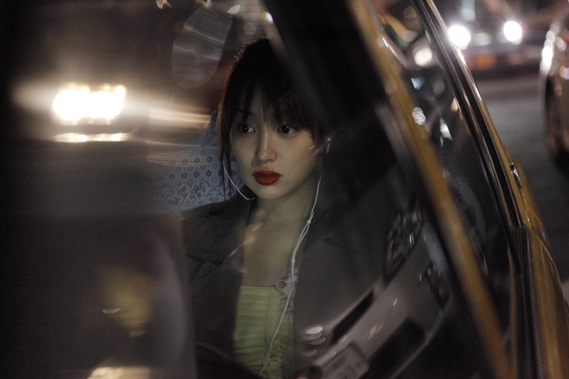 A girl in a taxi