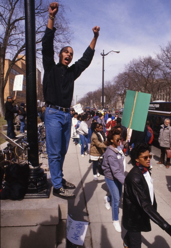 University of Michigan sophomore Michael Mason chants slogans as protesters go by