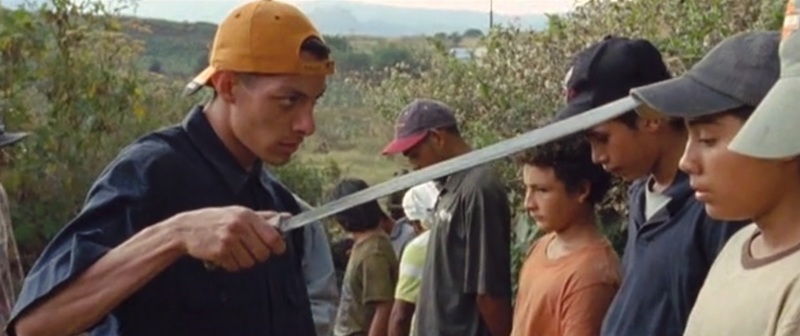 Screenshot of the boys in the film La Jaula de Oro getting harassed by a stranger along their journey.